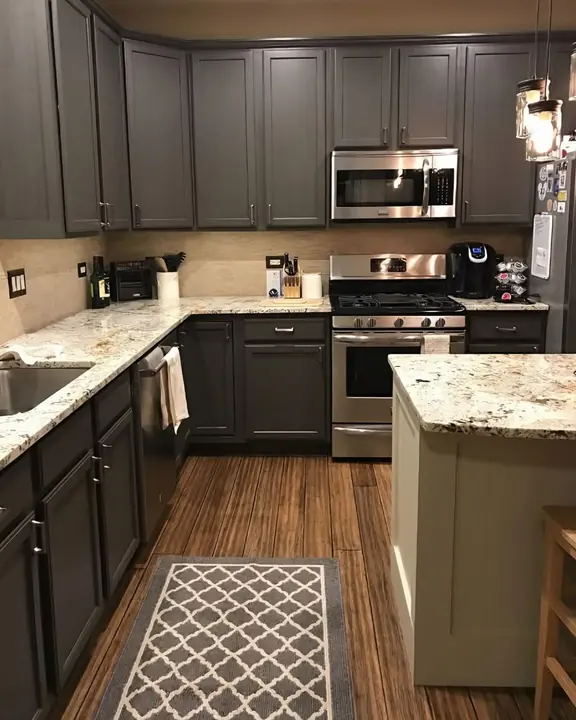 Charcoal shaker cabinets with granite counters and contrasting island